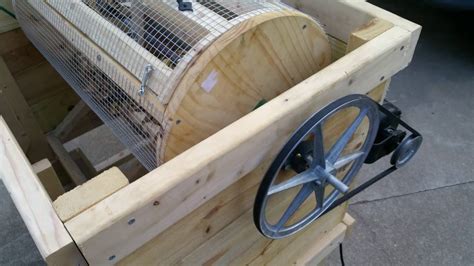 The motor sits on the edge of a shelf on front of the machine. . How to build a drum pea sheller